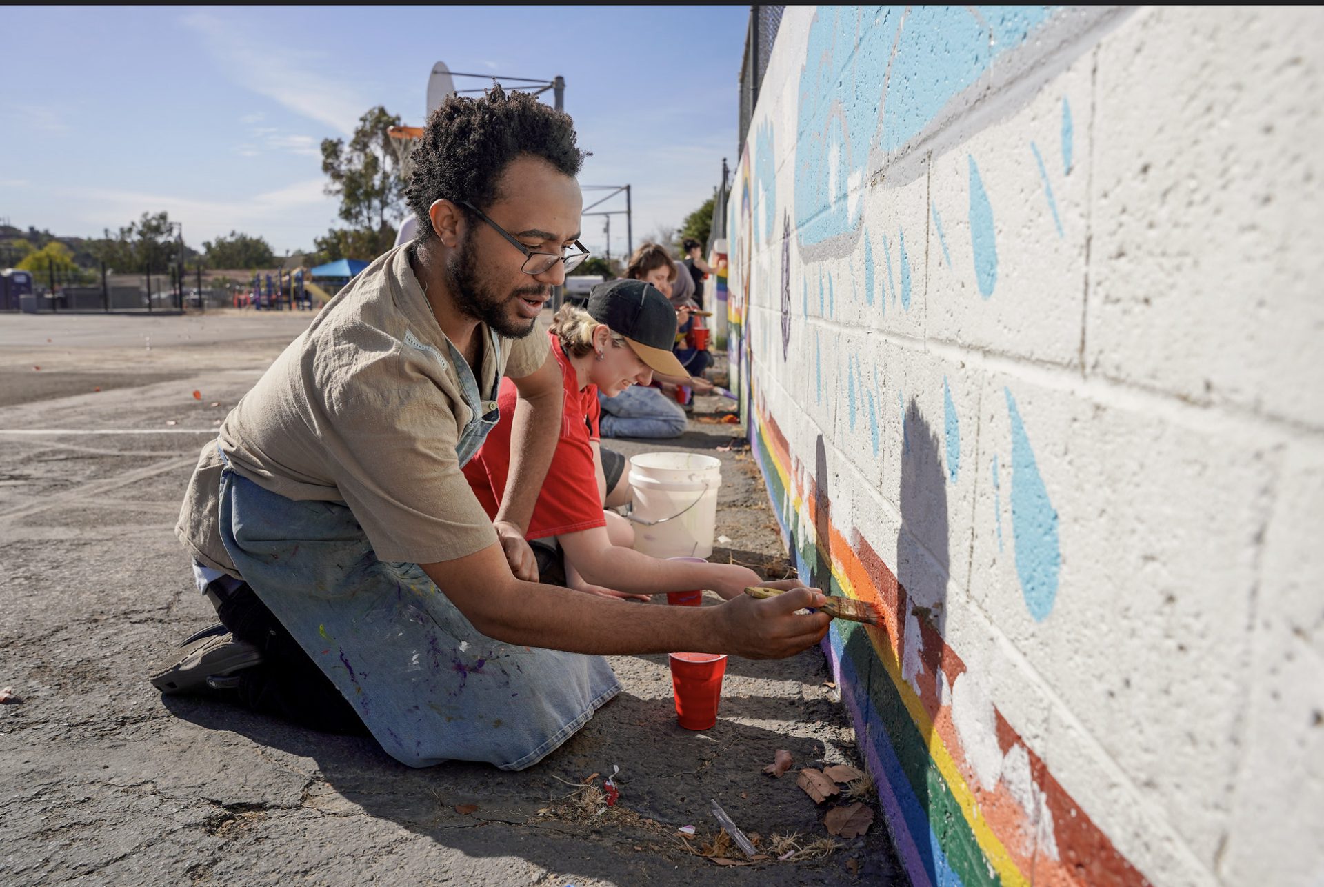 Students painting a community mural