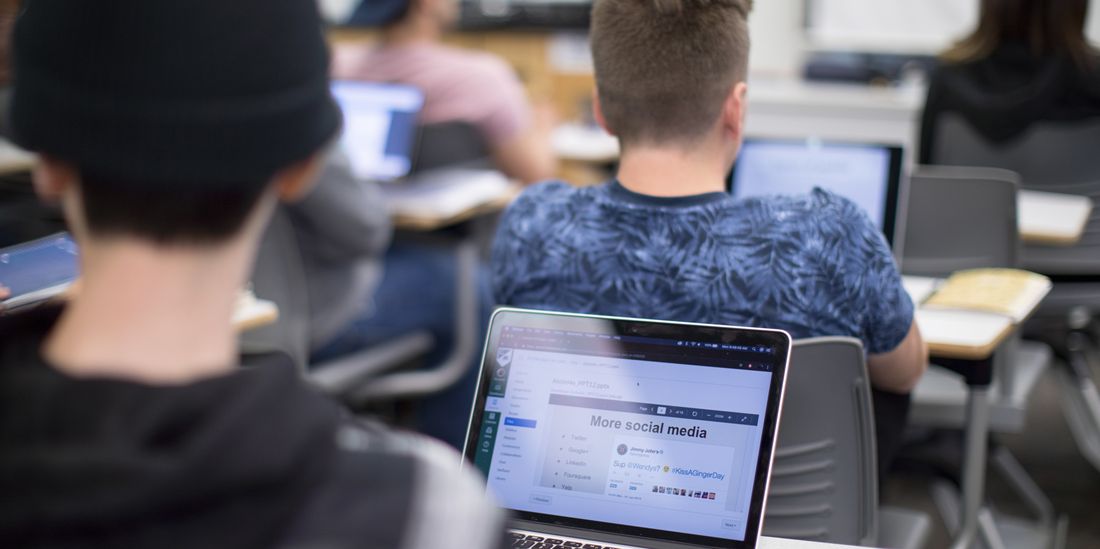 Students in classroom with laptops